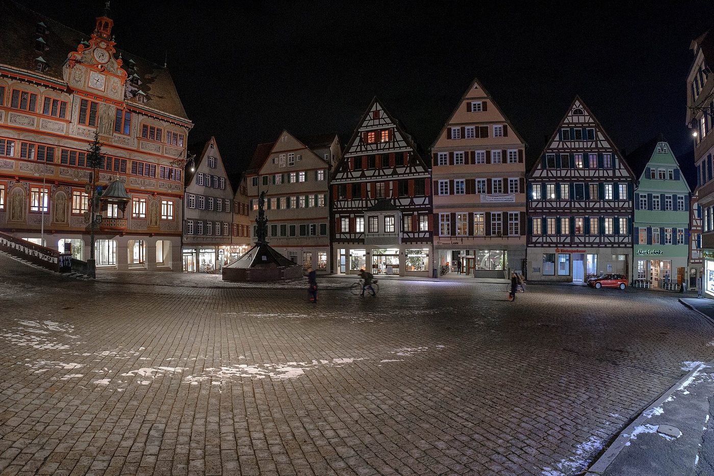 The empty market square of Tübingen at night, half-timbered houses around it